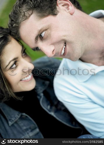 Close-up of a mid adult couple looking at each other and smiling