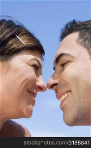 Close-up of a mid adult couple looking at each other with smiling