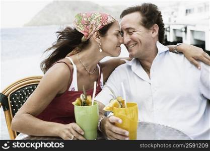 Close-up of a mid adult couple rubbing their noses and smiling