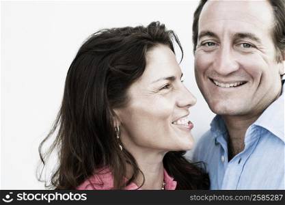 Close-up of a mid adult couple smiling