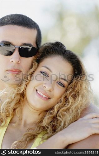 Close-up of a mid adult man and a young woman