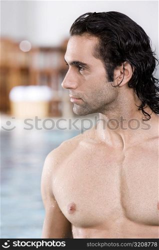 Close-up of a mid adult man at the poolside