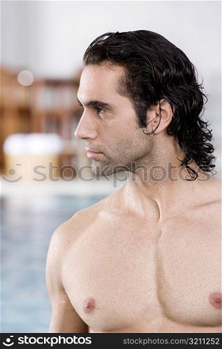 Close-up of a mid adult man at the poolside