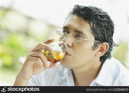 Close-up of a mid adult man drinking wine