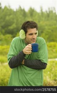 Close-up of a mid adult man holding a coffee cup