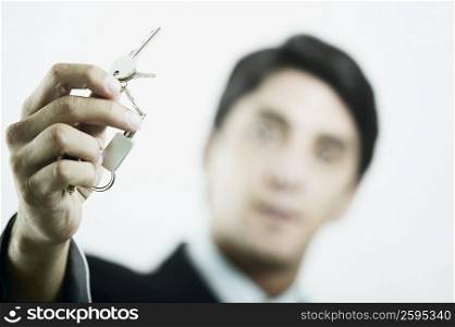 Close-up of a mid adult man holding a key ring