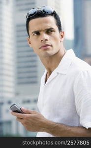 Close-up of a mid adult man holding a mobile phone