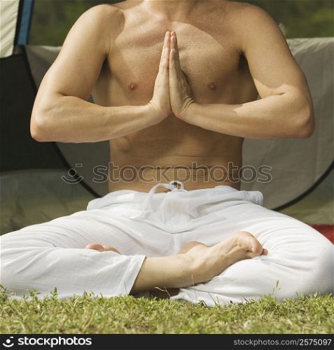 Close-up of a mid adult man in a prayer position