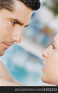Close-up of a mid adult man looking at a mid adult woman