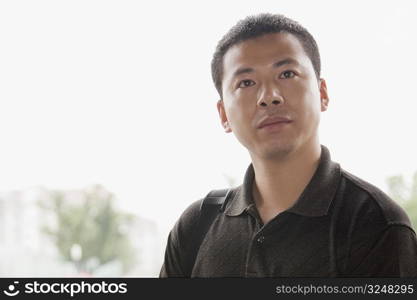 Close-up of a mid adult man looking away