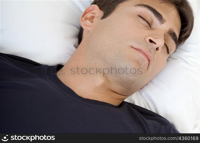 Close-up of a mid adult man sleeping