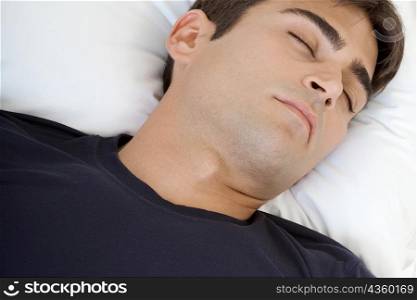 Close-up of a mid adult man sleeping