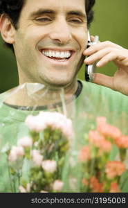 Close-up of a mid adult man talking on a mobile phone