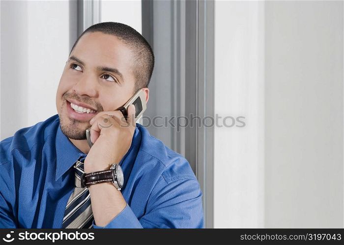Close-up of a mid adult man talking on a mobile phone