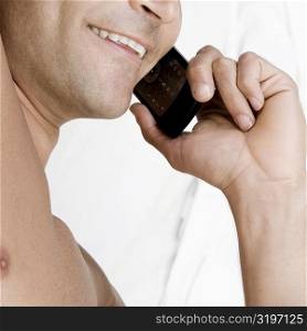 Close-up of a mid adult man talking on a mobile phone