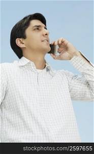 Close-up of a mid adult man using a mobile phone