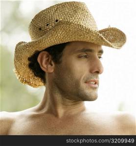 Close-up of a mid adult man wearing a cowboy hat