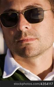 Close-up of a mid adult man wearing sunglasses