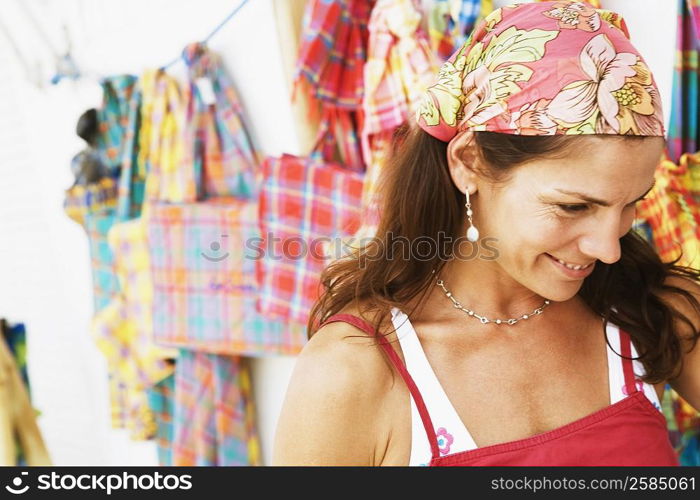 Close-up of a mid adult woman at a market stall and smiling