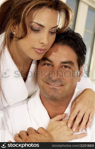 Close-up of a mid adult woman embracing a mid adult man