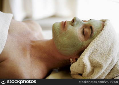 Close-up of a mid adult woman having a facial