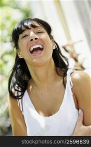 Close-up of a mid adult woman laughing