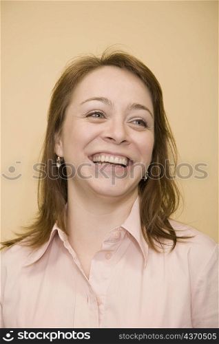 Close-up of a mid adult woman laughing