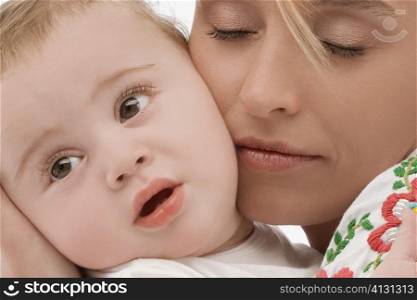 Close-up of a mid adult woman loving her son