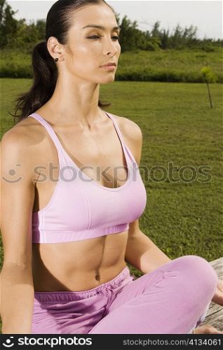 Close-up of a mid adult woman meditating