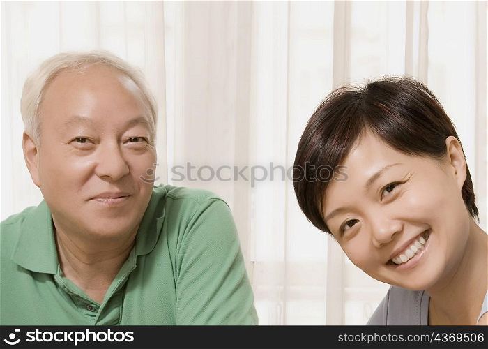 Close-up of a mid adult woman smiling with her father