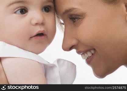 Close-up of a mid adult woman smiling with her son