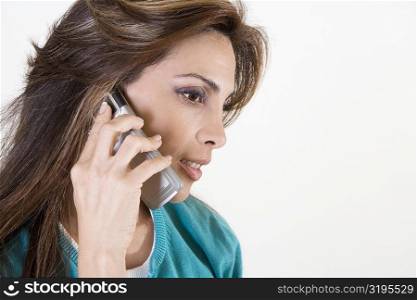 Close-up of a mid adult woman talking on a mobile phone