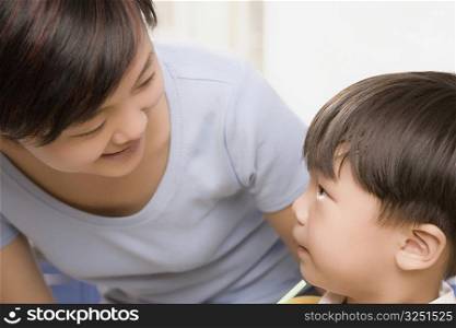 Close-up of a mid adult woman talking with her son