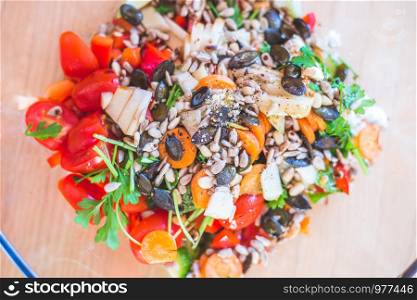 Close up of a mixed, healthy salad in a glass bowl, summer time
