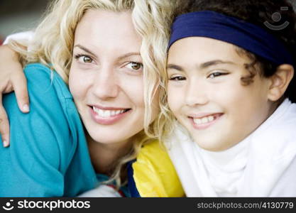 Close-up of a mother and her daughter smiling