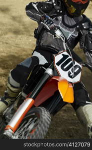 Close-up of a motocross rider riding a motorcycle