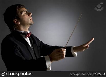 Close-up of a music conductor performing