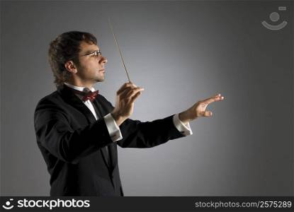 Close-up of a musician holding a conductor&acute;s baton