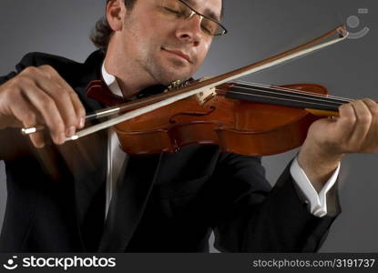 Close-up of a musician playing a violin