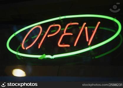 Close-up of a neon open sign lit up at night
