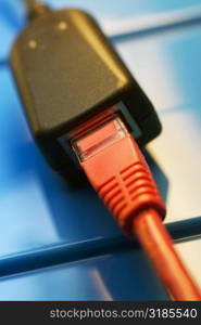 Close-up of a network cable plugged into a socket