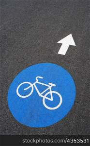 Close-up of a painted bicycle symbol on a road