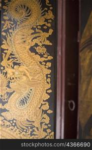 Close-up of a painting of a dragon in a temple