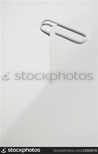 Close-up of a paper clip on blank paper