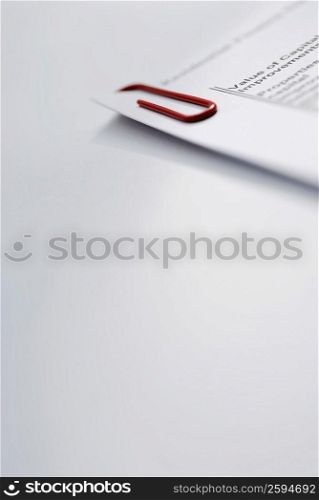 Close-up of a paper clip on documents