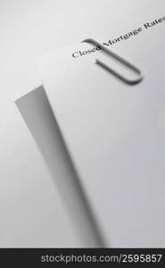 Close-up of a paper clip on paper