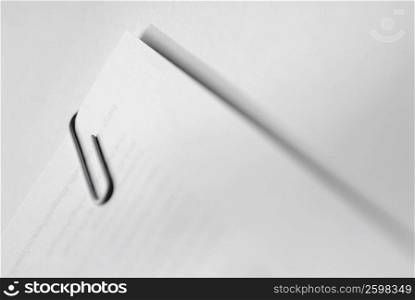 Close-up of a paper clip on papers