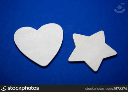 Close-up of a paper heart and a star