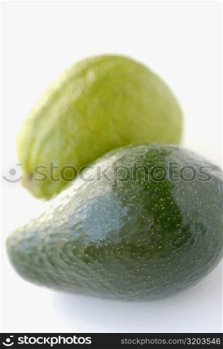 Close-up of a pear and a guava