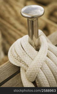 Close-up of a peg and a rope on the deck of a sailboat